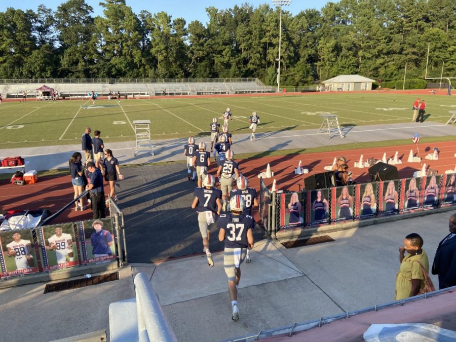 The first batch of patriot players enter the field for warmups, prior to Benjamin Russell @ Homewood.