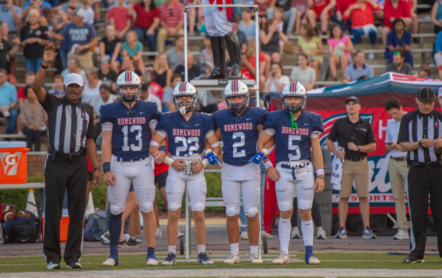 Homewood Football captains prepare to take the field. 