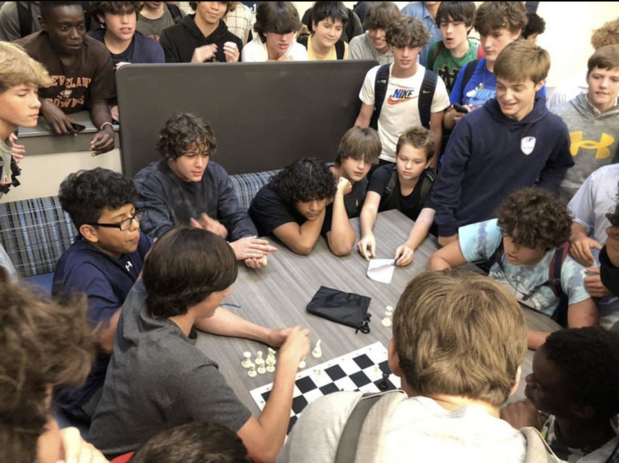 Scout Spencer (bottom left) and Blessing Zambu (far bottom right) play a match at the Club Fair surrounded by an enthusiastic audience. (Photo by Hayes Hopper)