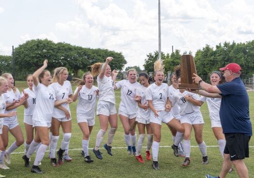 The varsity girls celebrate their championship victory (photo credits Homewood Athletics)