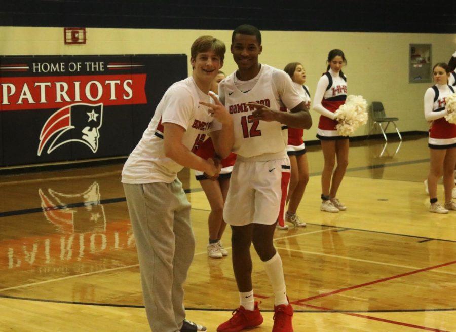 Jake Stephens (JR, left) poses with Cannon Armstead (SR, right) before tip off (photo by Russell Dearing)