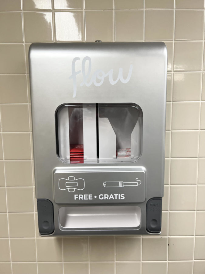 A new dispenser in a girls bathroom in HHS stocked with free feminine products. (Photo by Merritt Hartsell.)