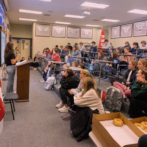 Students sit through FCA meeting.