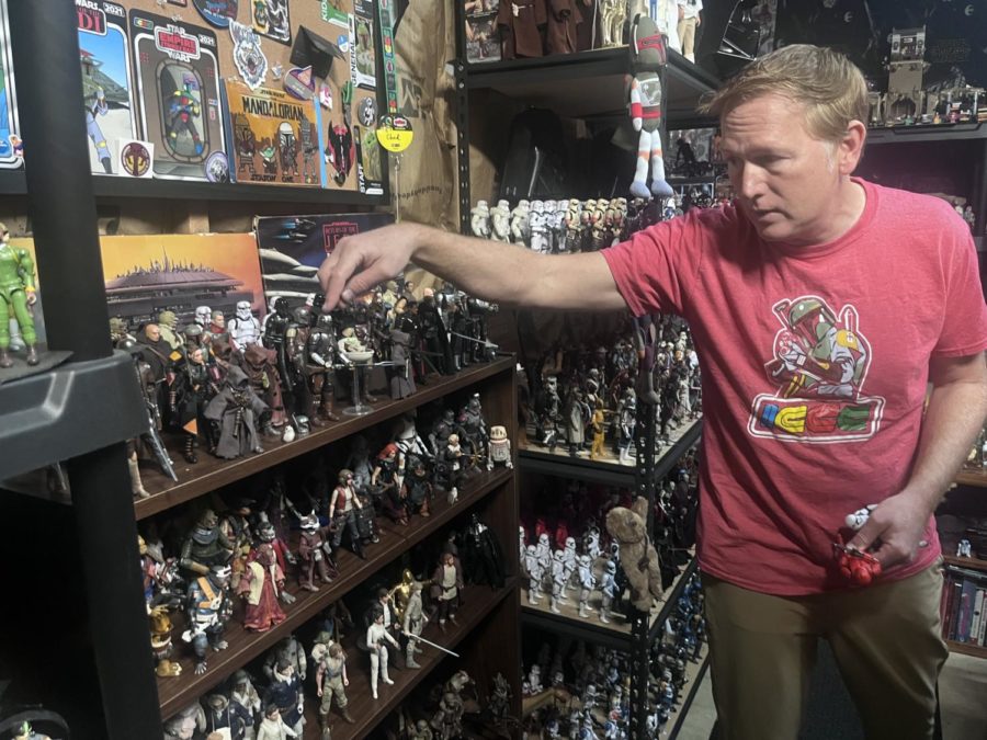 HHS English teacher and avid Star Wars fan Chad Cooley shows off a small fraction of his toy collection. 