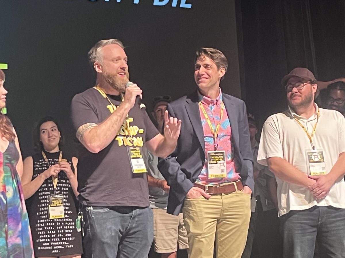 Jeremy Burgess (left) speaks beside director Benjamin Stark and other Dont Die collaborators at the Sidewalk Film Festival.