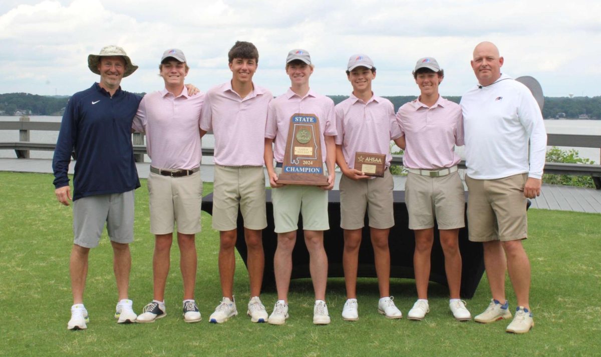 The Homewood boys golf team poses with the state championship trophy and coaches Rick Baguley (far left) and Jason Haithcock (far right). Jack Lowery was named MVP of the tournament.