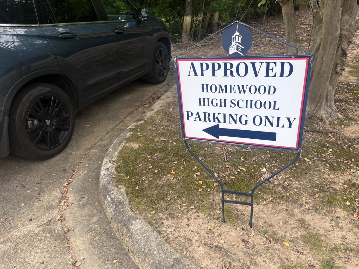 A sign indicates the extra parking spaces allotted to Homewood students at Samford's intramural field. Some students were moved to this parking lot  days before school began. 