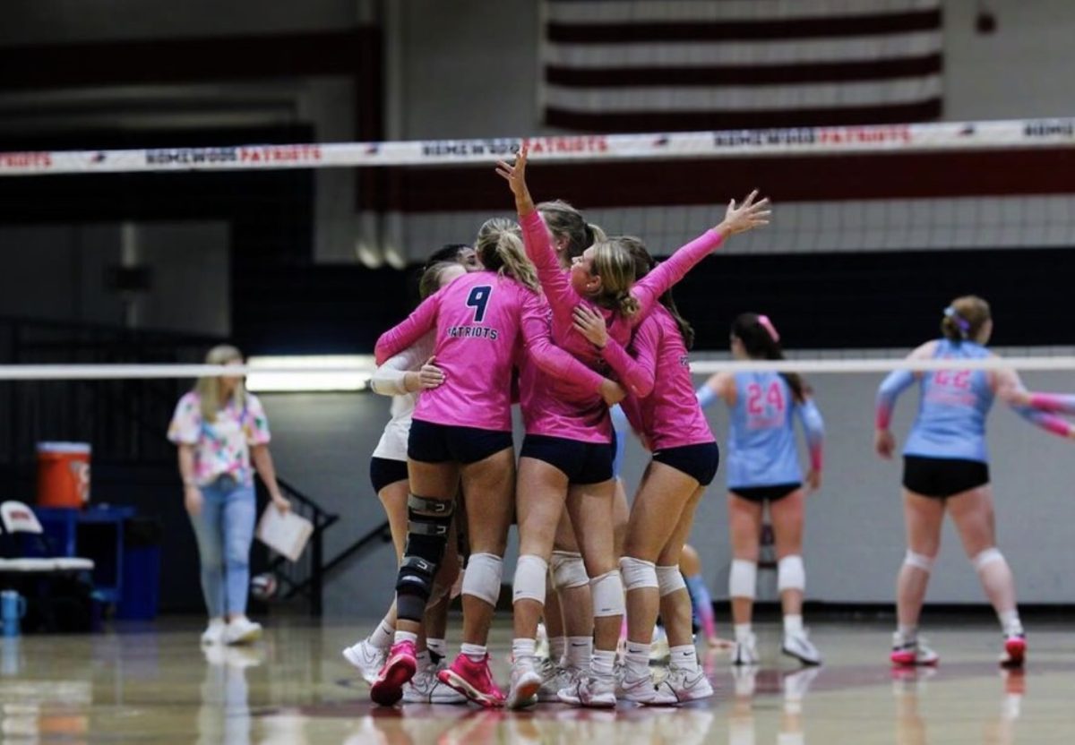 The team celebrates after a point against Northridge.