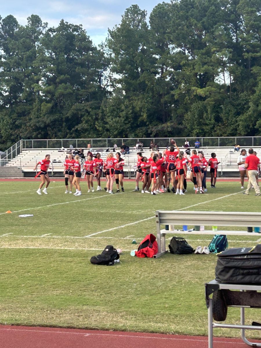 The flag football team celebrates after a victory over Ramsay. They won that game 19-6.