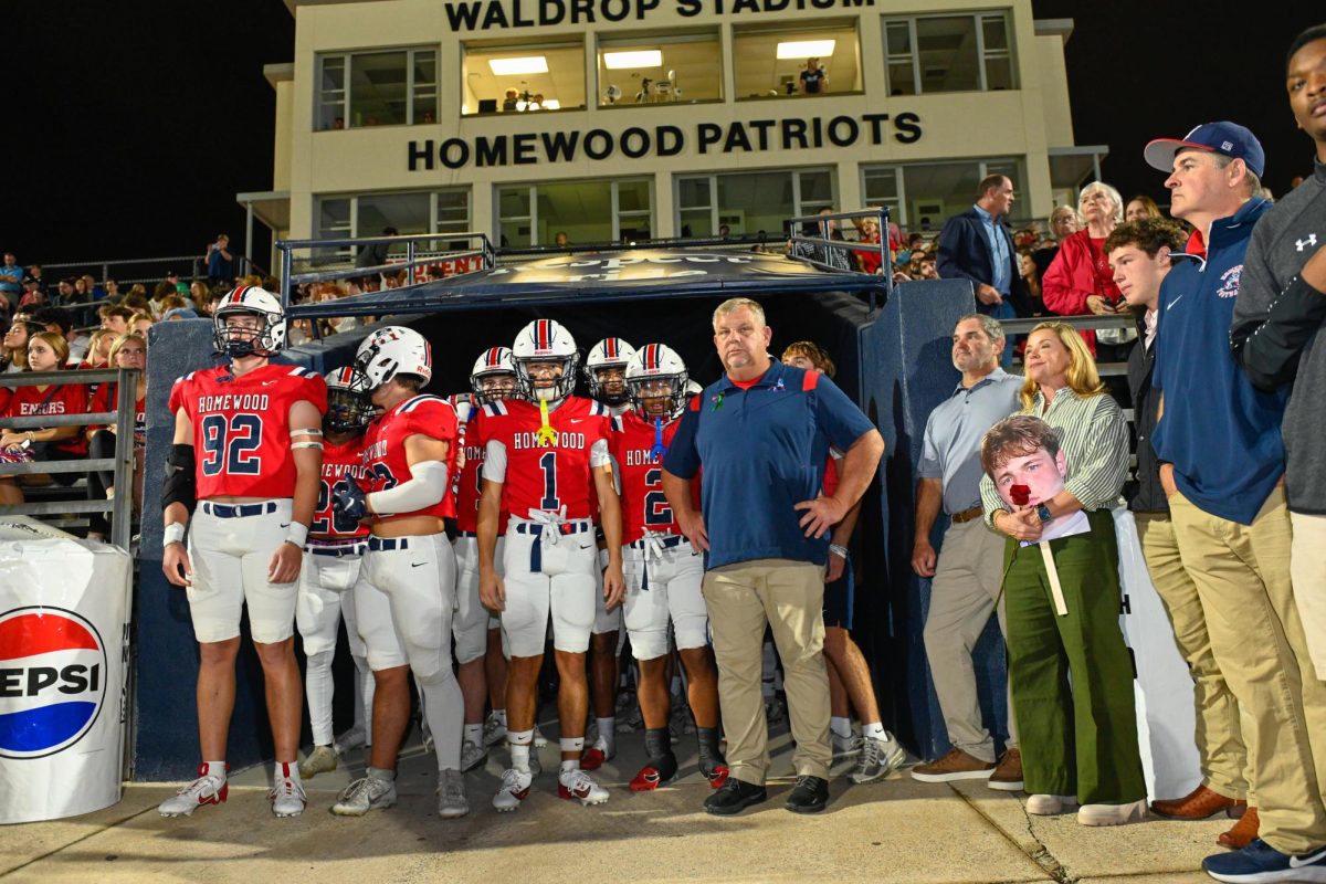 Head Coach Ben Berguson and the Patriots in the tunnel before the regular season finale vs. James Clemens.