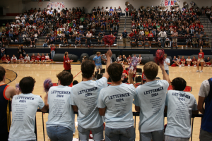 Homewood letterman show school spirit at pep rally. 