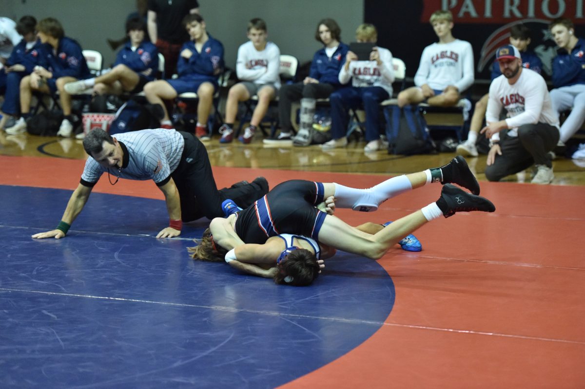 Junior Graham Jourdan takes on Oak Mountain opponent during in-school wrestling match last season.