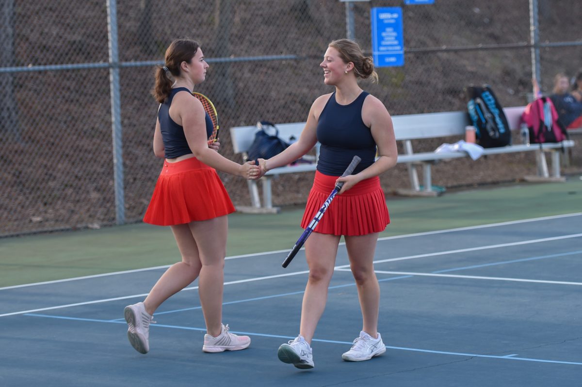 Senior tennis player Madeleine Ann Brockwell congratulating Lauren Brown in last years match. 