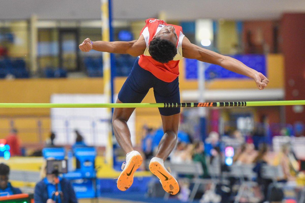 Junior John Martin participates in the high jump at State. He placed third in this event and achieved his season best by clearing 6 feet (1.83m)