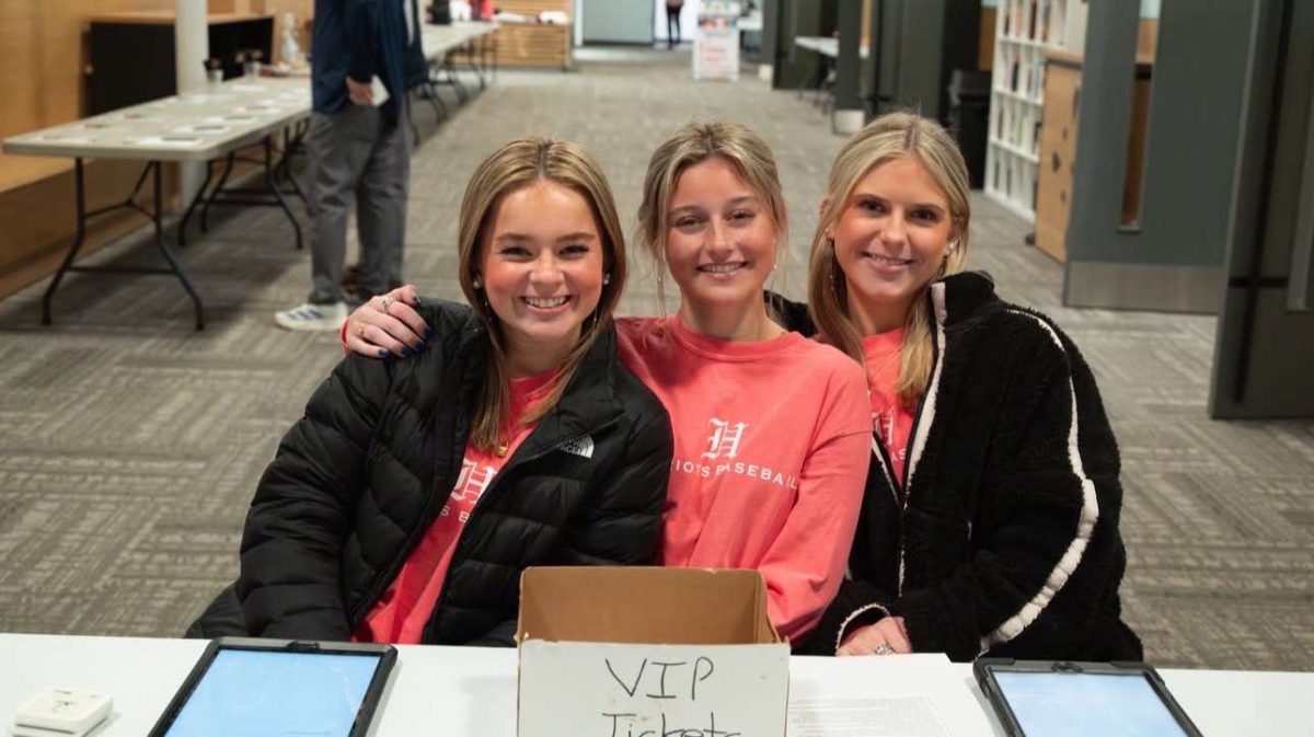 From left to right: Wesley Cook, Ava Chiesa, and Cecily Daughtery working concession stands at varsity baseball game. 