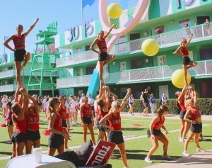 The competition cheer team practices their stunts on the practice field of Walt Disney World Resort in Florida. 