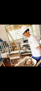 Colton Cox moves debris during a previous mission trip in Colombia. This summer he'll embark on another service journey to Spain.