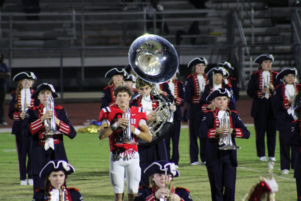 Hilton Patterson performs with the band during halftime at the game against Jackson-Olin. Patterson has been doing this for multiple years, exemplifying Homewood's unique strive to fulfill students' unique potential.