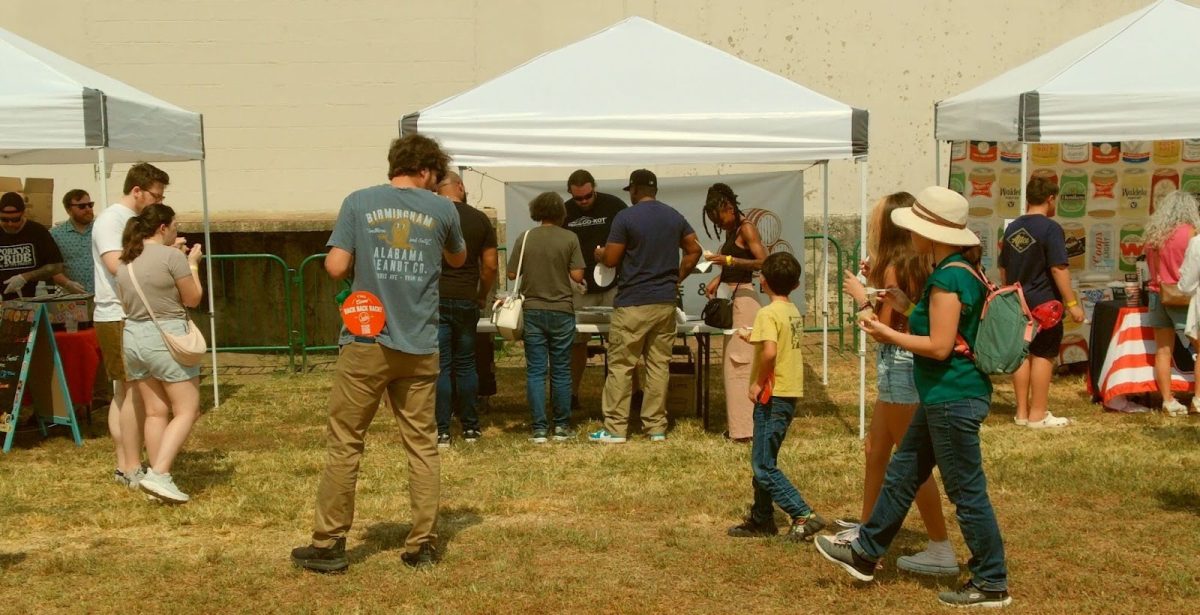  Attendees walk around different booths at the Back Forty Beer Company, trying out various mac and cheese from seven chef competitors. Over the past eight years, more than 10,000 attendees have participated in the festival.

