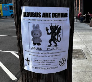 Unspecified religious group posted ideas of the connection between demons and the Labubu on a pillar located by Peppers Place Farmers Market.