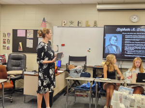 Casey Piola teaches sophomore students about the Civil War. Her "high challenge, low threat" method builds skills over time, creating a supportive learning environment.