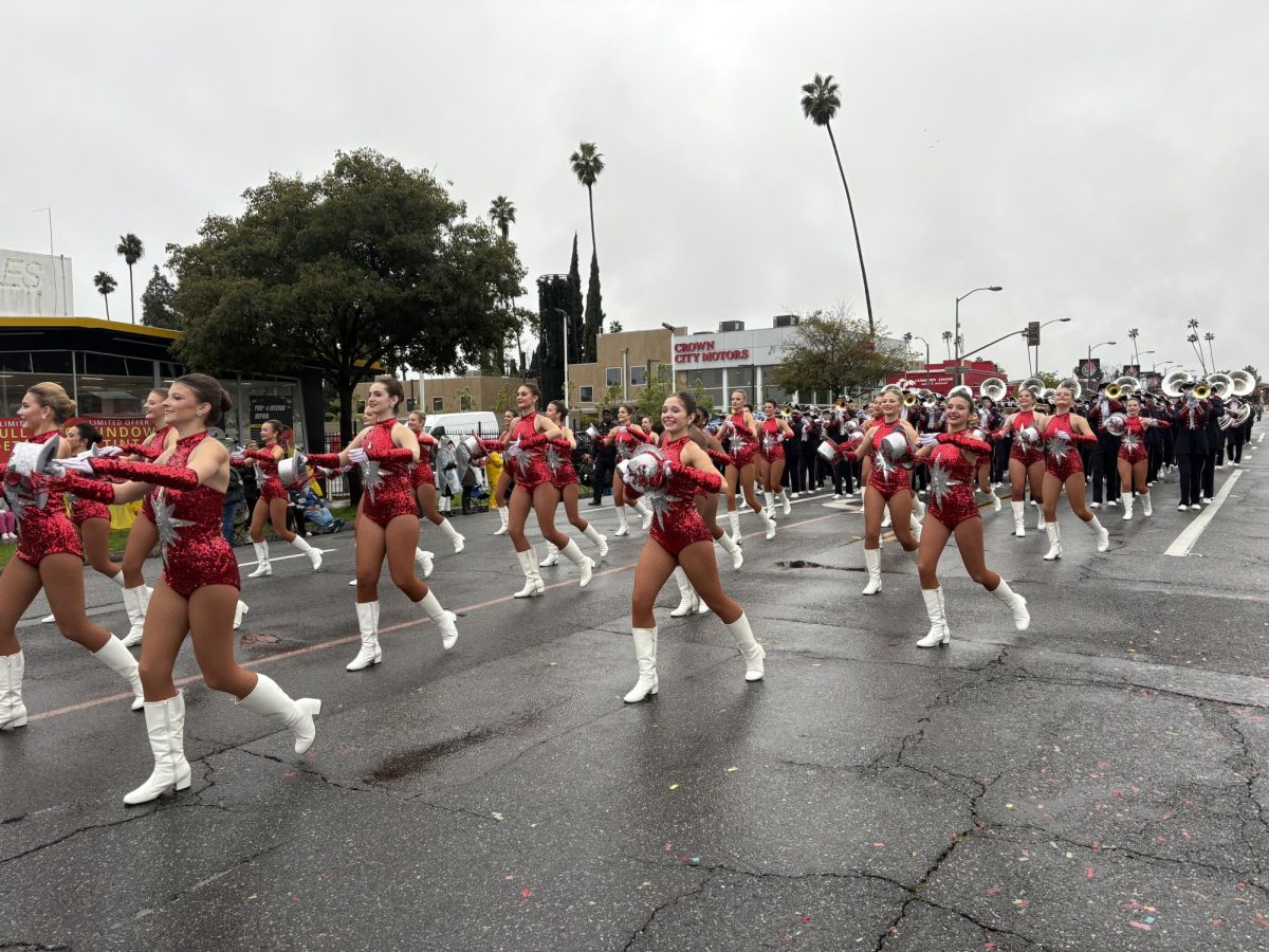 The Star Spangled Girls march in rows at the 137th Rose Parade. The Pasadena parade featured 19 bands, including two bands from Japan and Mexico. Courtesy of Jennifer Ayers.
