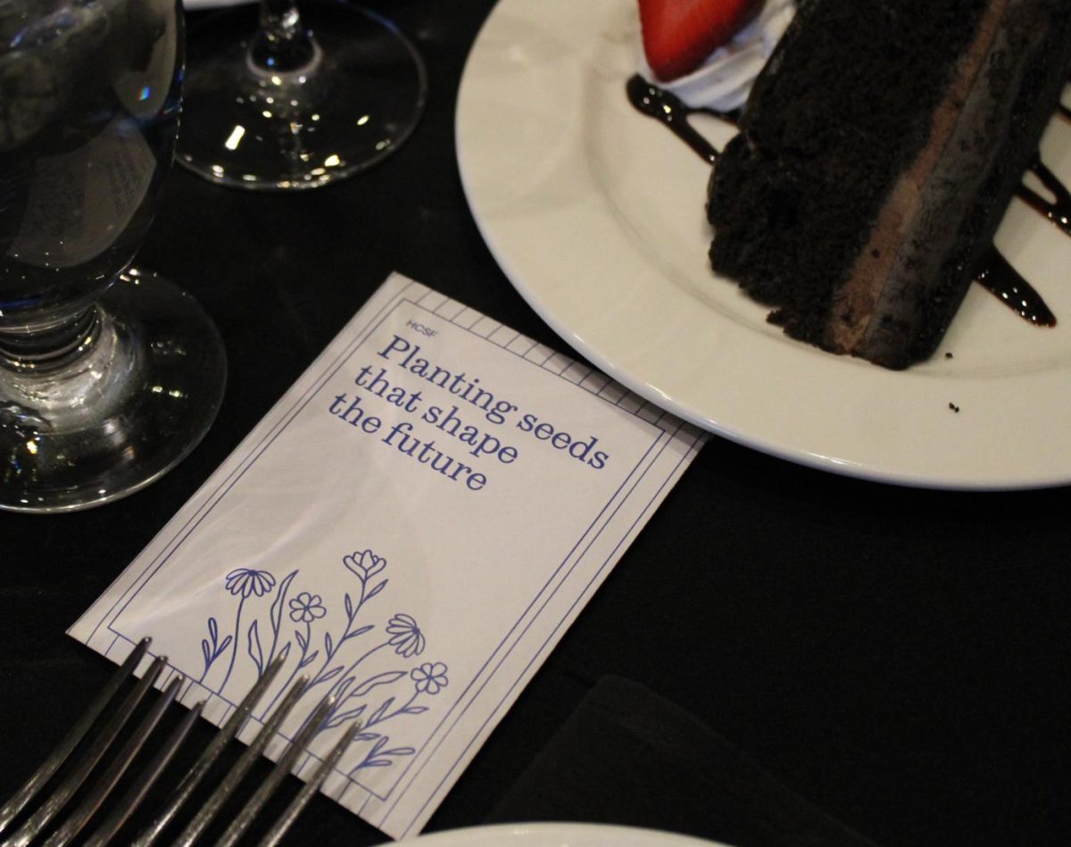 A seed packet lies on event tables at The Club. These party favors were distributed during the event to signify the HCSF's commitment to fostering educational growth.