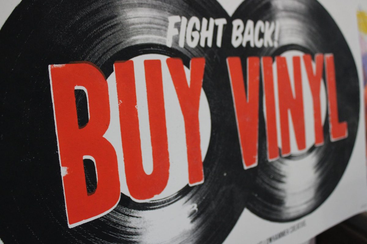 A "Fight Back! Buy Vinyl" sign sits on display at Seasick Records. The Birmingham record store remains a popular destination for young and old physical media aficionados.