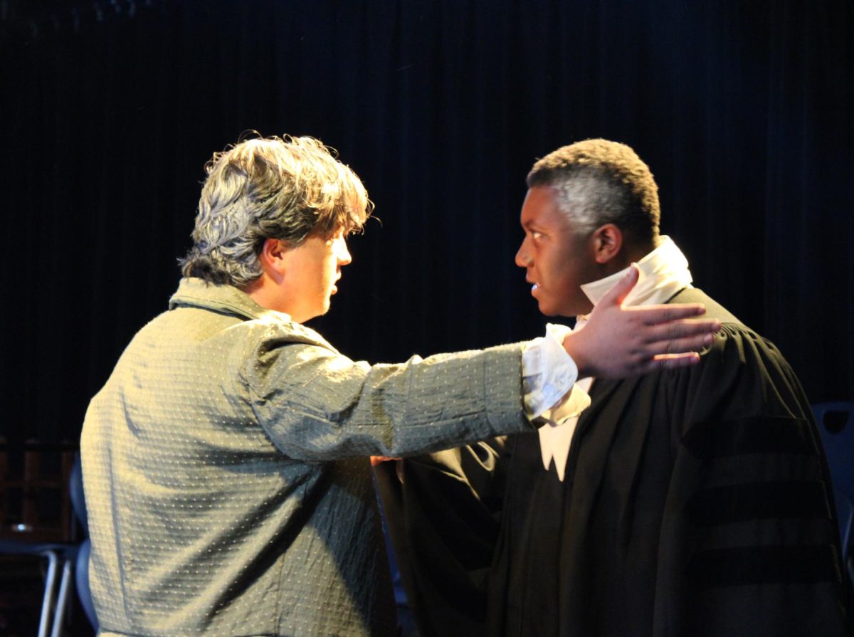 Seniors Theo Harris (left) and Stephen Sutton intensely argue on stage. Many scenes in The Crucible are packed with intensity and emotion.