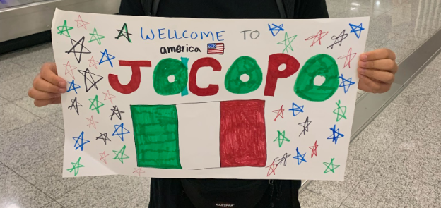 A sign welcomes the Roberts' Italian exchange student Jacopo to America. The family plans to host a new student from the Netherlands in the future.